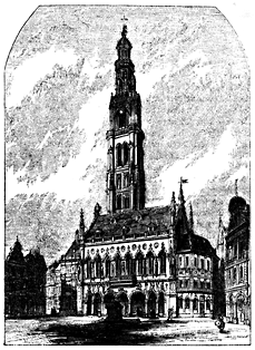 A large two-story building with a tall tower.