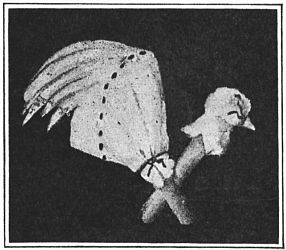 Fig. 104&mdash;Pull a little of the cotton out to make a beak.