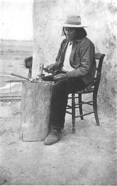 A fashionable metal-worker of Taos, New Mexico, who has
not adhered to the native costume
