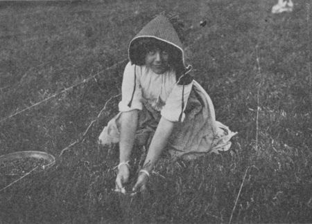 Fig. 47.&mdash;A Young Worker. Notice how the Berries are picked.