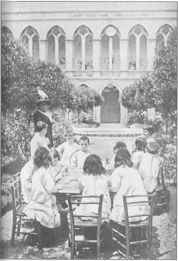 THE CLOISTER SCHOOL OF THE FRANCISCAN NUNS IN ROME
Children playing a game with tablets of coloured silk